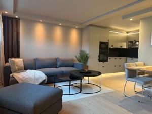 a living room with a couch and a table at Villa Nyheim in Florø