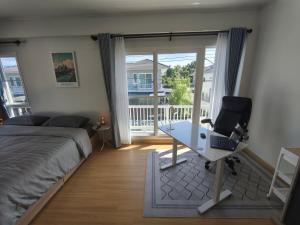 a bedroom with a bed and a desk with a laptop at Silbergluuk in Udon Thani +71 photos