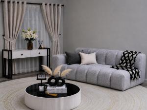 a living room with a couch and a table at One bedroom in Narok