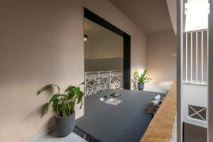 a dining room with a table and a mirror at Hindavi Green Escape by VEO - Part of StayVista with Bonfire, BBQ & Pool in Pune +43 photos