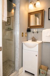 a bathroom with a sink and a shower at Inn on Bellevue in Newport
