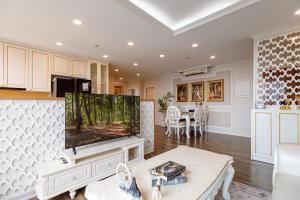 a living room with a large flat screen tv at 2BR 3BR Luxury Apartment Sky Pool in Ho Chi Minh City