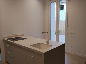 a kitchen with a sink and a counter at Apartamento La Font in Pego +27 photos