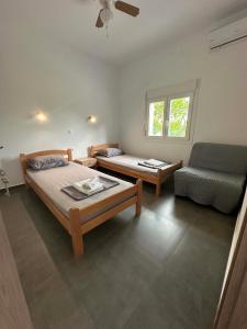 a living room with a bed and a couch at Sunset Apartment A-3 in Perea