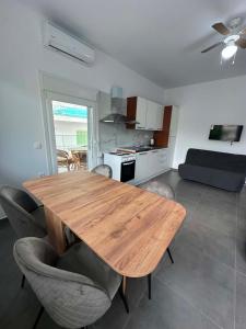 a wooden table and chairs in a living room at Sunset Apartment A-3 in Perea