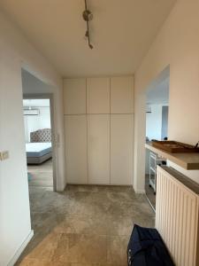 a room with a large white closet and a bed at The North Antwerp Apartment in Antwerp +5 photos
