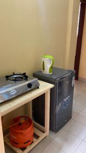 a stove top oven sitting on top of a counter at Margin Diani in Ukunda