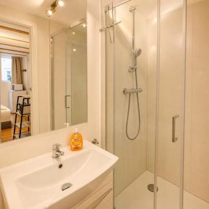 a bathroom with a sink and a shower at Wismar Apartments - Cozy and Central in Wismar