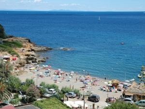 a group of people on a beach with the ocean at Le Maree Susanna in Rio Marina +3 photos