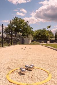 a group of balls sitting on a baseball field at Villa des Roches - Labeaume in Labeaume +62 photos