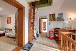 a room with a kitchen and a living room at Apartamenty i Pokoje w centrum Karpacza in Karpacz +25 photos