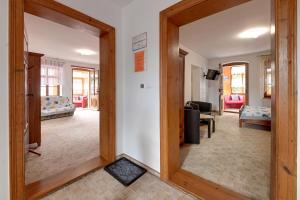 a mirror in a room with a living room at Apartamenty i Pokoje w centrum Karpacza in Karpacz