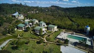 an aerial view of a house with a swimming pool at Echoes of forest in Andasibe