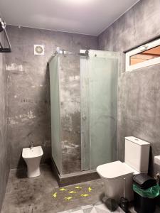 a bathroom with a shower and a toilet and a sink at Солнышко VIP 1 in Chok-Tal +18 photos