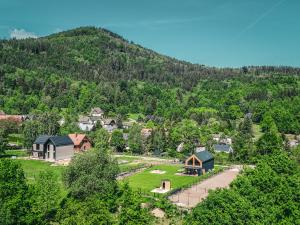 an aerial view of a village in a mountain at Miło Tu - Stodoła pod Karpaczem in Miłków