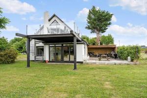 a house with a glass roof on top of a yard at 4231-Stege-Nymarksvej-21 in Stege