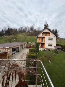 a large house with a driveway in front of it at Lucatony's Guesthouse in Cîmpeni