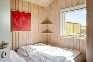 a bedroom with a bed in a wooden wall at 1319-Thisted-Store-Knuds-Vej-9 in Thisted