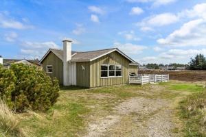 a house with a white fence in front of it at 1319-Thisted-Store-Knuds-Vej-9 in Thisted