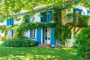a blue and white house with a yard at Maison De Charme Avec Jacuzzi in Arcangues +36 photos