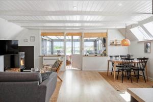 a living room with a couch and a table at 1335-Vestervig-Spovevej-11 in Vestervig