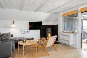 a living room with a couch and a table at 1335-Vestervig-Spovevej-11 in Vestervig