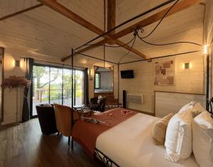 a bedroom with a large bed in a room at Domaine de Meros in Plonévez-du-Faou +71 photos