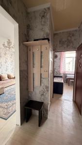 a room with a room with a table in it at Квартира Алимжанова 16 Балхаш in Balqash