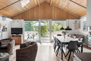 a dining room with a table and chairs at OH293-Hadsund-Jaegerskoven-15 in Hadsund