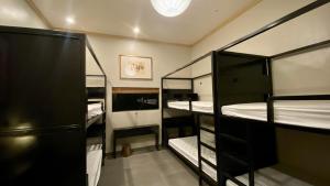 a room with four bunk beds in a room at Lavung Village in Ða Gia