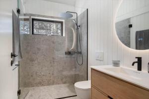 a bathroom with a shower and a toilet and a sink at 1385-Bedsted-Thy-Nedergardsvej-5 in Istrup +25 photos