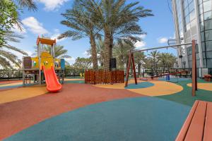 a playground with a slide and play equipment at Ibis Abu Dhabi Gate in Abu Dhabi
