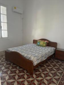 a bedroom with a bed in a room at 3 bedroom Villa with garden in Ez Zahra
