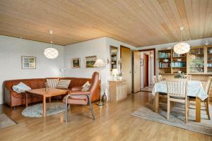 a living room with a couch and a table at 1039-Stege-Rylevej-30 in Stege +12 photos