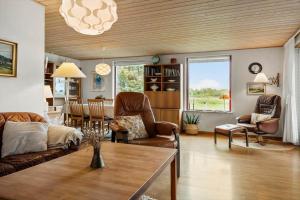 a living room with a couch and a table at 1039-Stege-Rylevej-30 in Stege