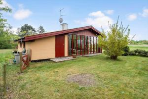 a small house in a field with a yard at 1039-Stege-Rylevej-30 in Stege