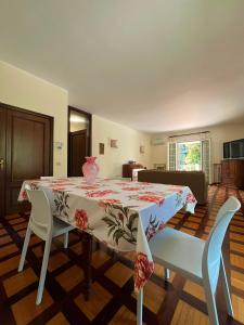 a dining room with a table and two chairs at Villa Magnolia in Vicenza