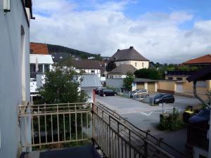 a view of a parking lot from a balcony at Apartment Mammut Loft in Balve +7 photos