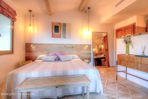 a bedroom with a large bed and a mirror at Casa penisula in Porto-Vecchio +61 photos