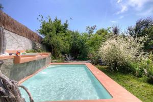 a swimming pool in the backyard of a house at Couvent d'alando in Alando