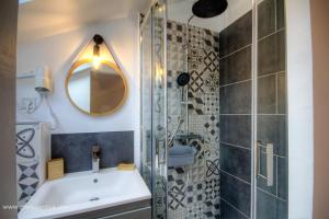 a bathroom with a shower and a sink and a mirror at Casa di l'apa in Venaco +36 photos