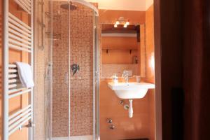 a bathroom with a shower and a sink at Zavaglia House in Lainate
