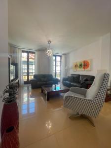 a living room with a couch and a table at Casa Príncipe 12 in Cambados