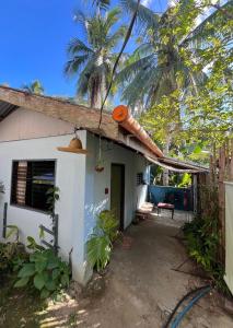 a small white house with a palm tree at The Artist House in Burgos