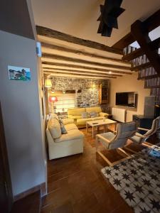 a living room with a couch and a table at Casa Robelca in Biescas
