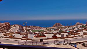 a view of a city with the ocean in the background at Chalet in Porto Sokhna Hanging Gardens - Fifth Terrace Sea View شاليه في بورتو السخنة - الحدائق المعلقة - المصطبة الخامسة - إطلالة بحر مباشر in Ain Sokhna