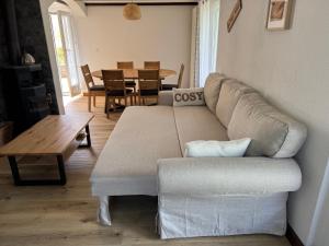 a living room with a couch and a table at Chez Aless in Ovronnaz