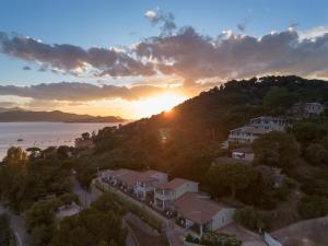 an aerial view of a resort with the sunset at Elbitat Wellness&Spa in Bagnaia +50 photos