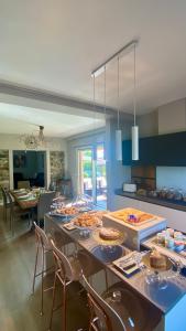a kitchen with a table with food on it at Casa Clerici 1956 in Erbusco +41 photos