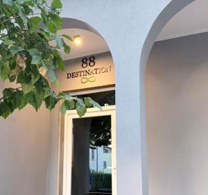 an entrance to a restaurant with a sign above a door at 88 Destination in Treviglio